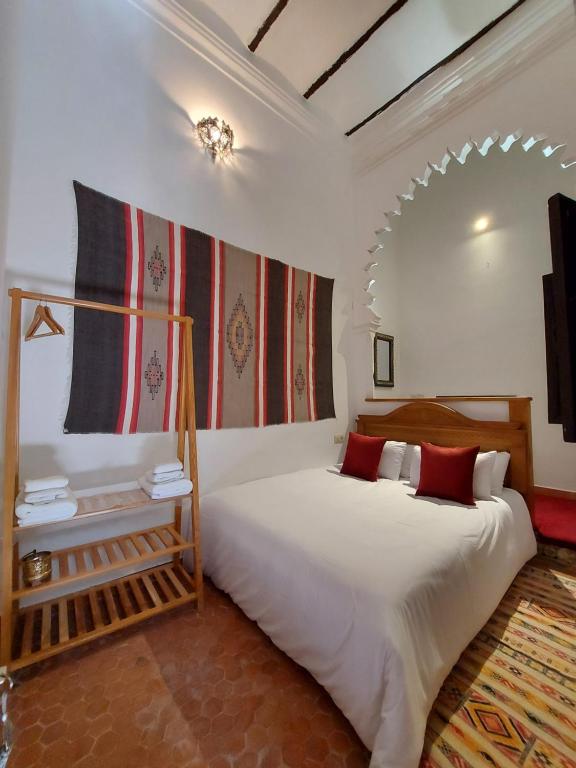 Letto o letti in una camera di Riad & Café culturel BAB EL FAN