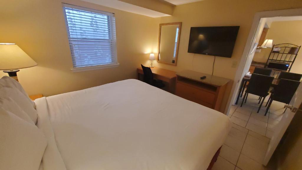 Postel nebo postele na pokoji v ubytování Sandbox Motel