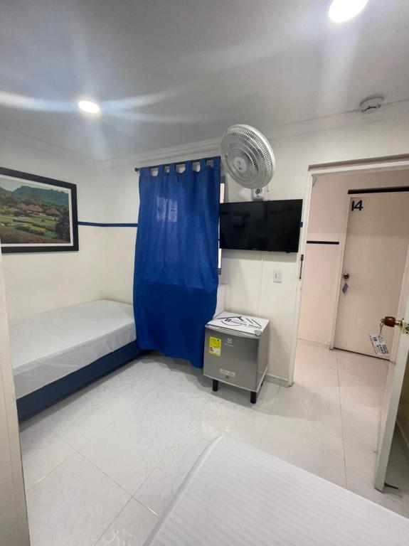 Postel nebo postele na pokoji v ubytování Casa Hotel Manco Mora