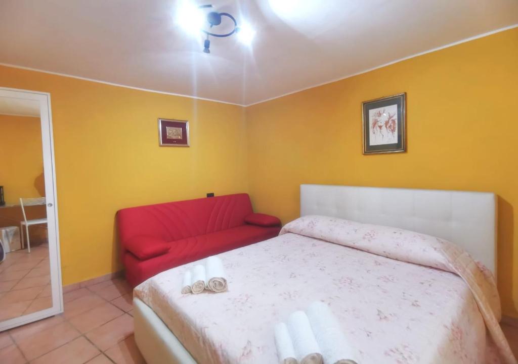 A bed or beds in a room at Casetta Arco