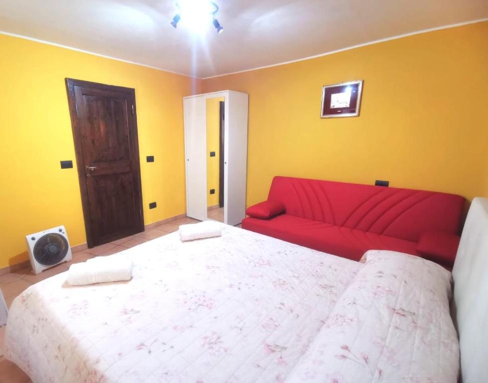 A bed or beds in a room at Casetta Arco