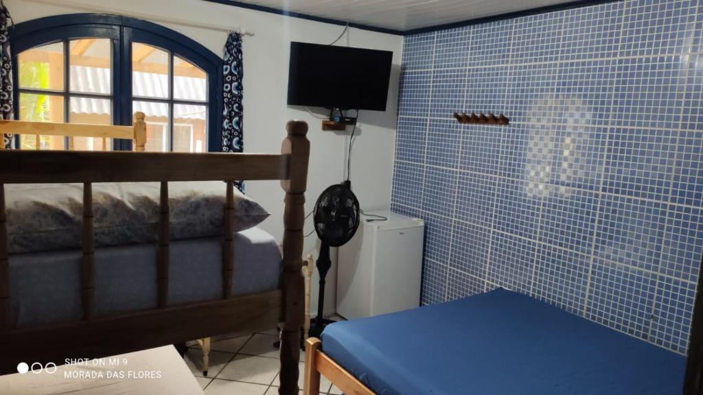 Postel nebo postele na pokoji v ubytování Pousada Morada das Flores
