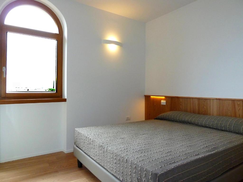 Postel nebo postele na pokoji v ubytování La Berlera - Riva del Garda