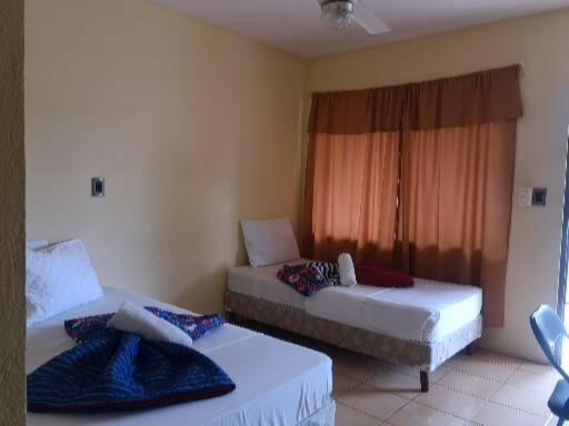 Postel nebo postele na pokoji v ubytování Hotel Real Alaska