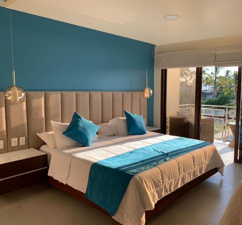 Postel nebo postele na pokoji v ubytování Hotel La Laguna Galapagos