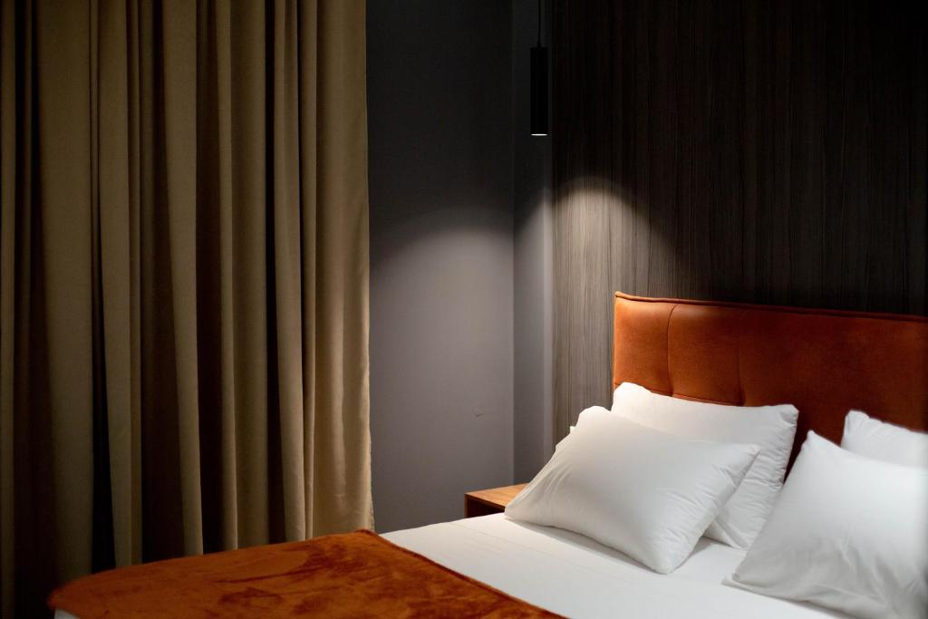 Postel nebo postele na pokoji v ubytování Mergan Hotel