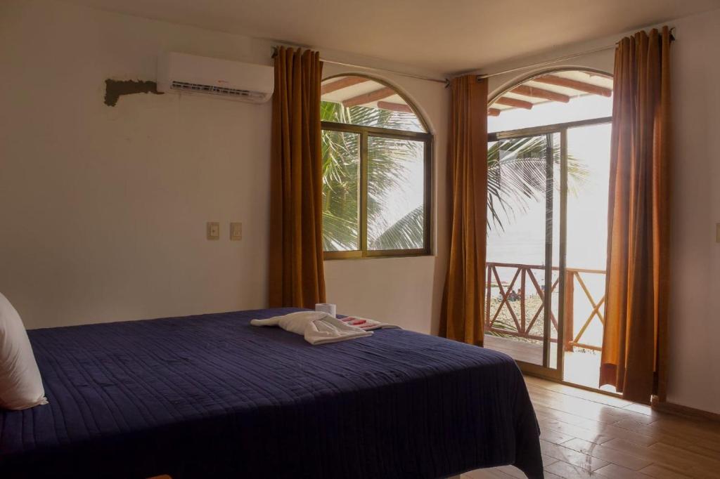 Postel nebo postele na pokoji v ubytování Hotel El Rincon de Don Juan