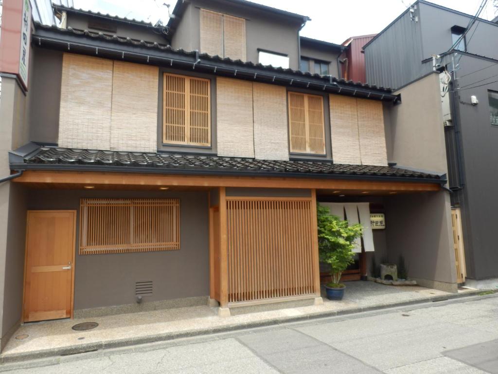 a building with boarded up windows and a street at Murataya in Kanazawa
