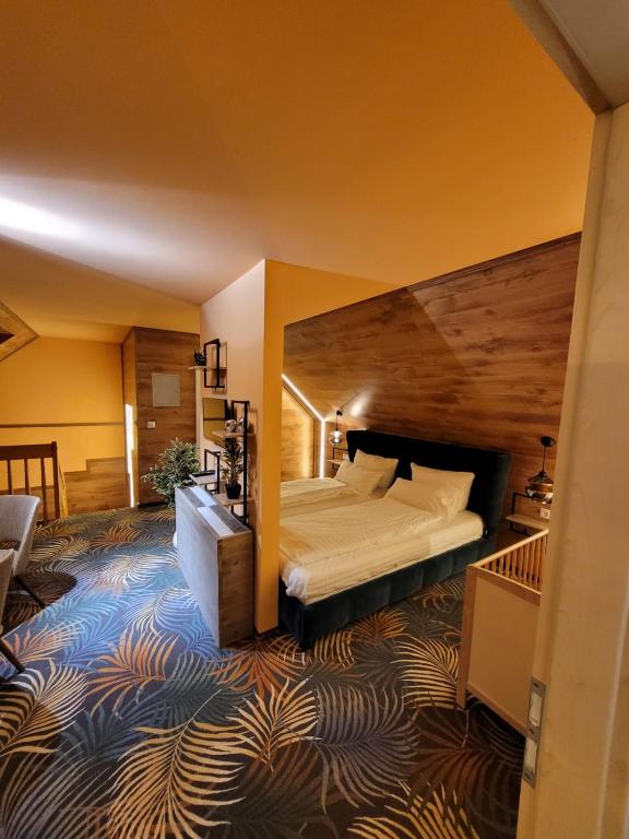Postel nebo postele na pokoji v ubytování Ambiente Hotel garni