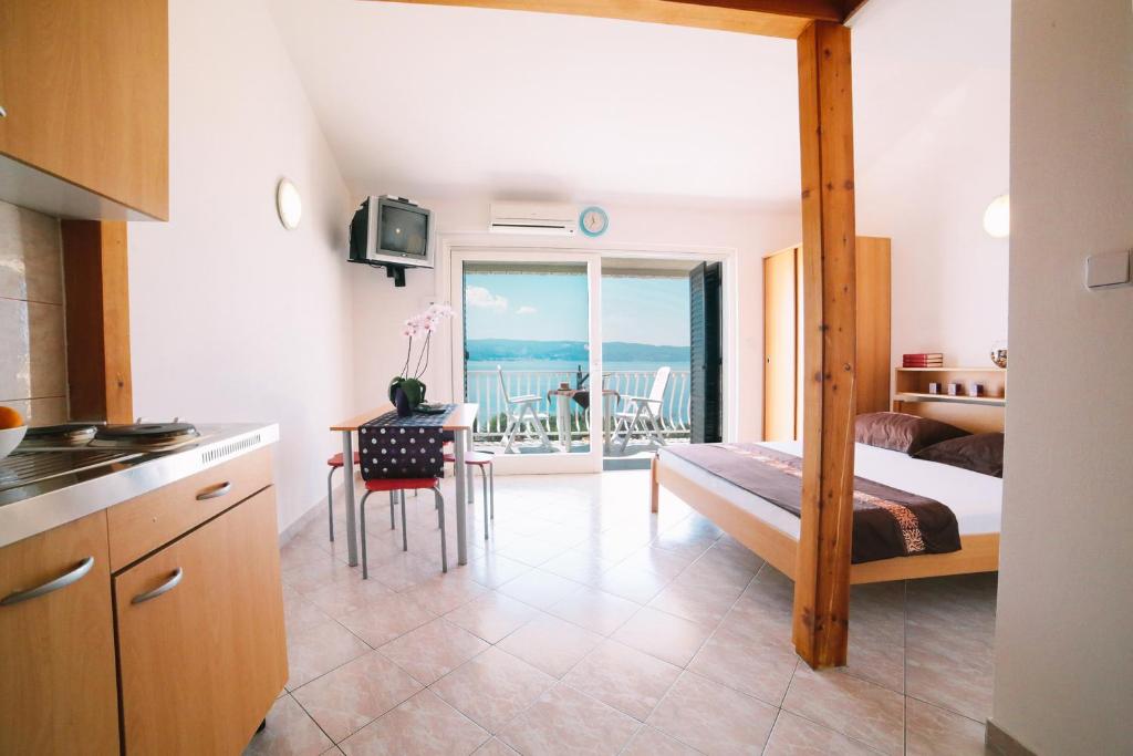 Postel nebo postele na pokoji v ubytování Villa Brigita