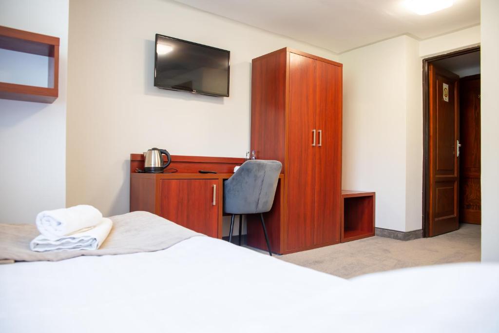 Posteľ alebo postele v izbe v ubytovaní POŁONINY Resort
