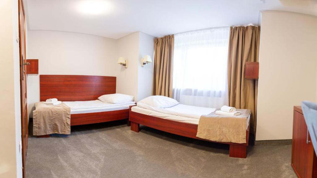 Posteľ alebo postele v izbe v ubytovaní POŁONINY Resort