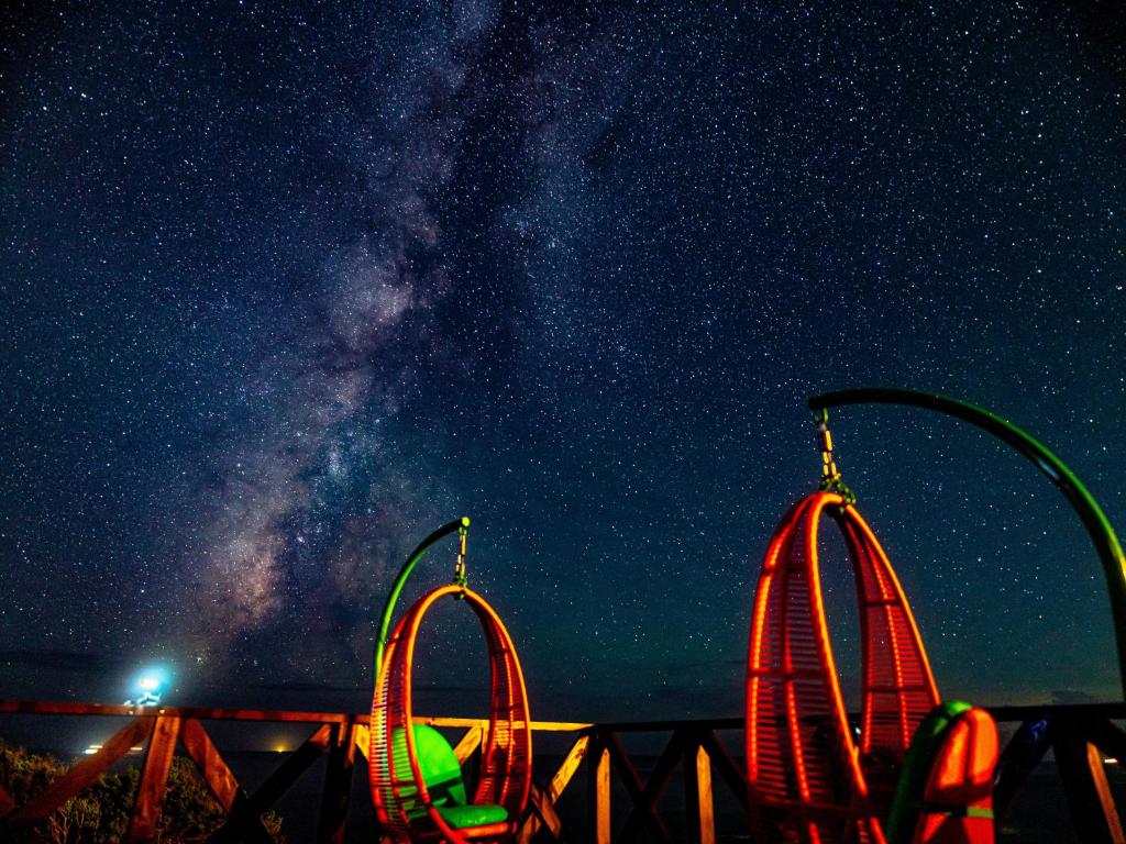 a starry night with the milky way and a roller coaster at XYZ speciale in Shirahama