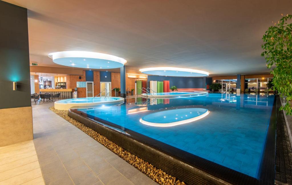 The swimming pool at or close to Hunguest Szeged - ex Forrás