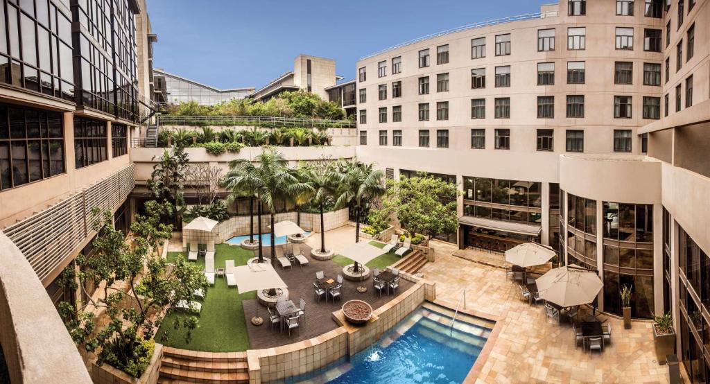 an overhead view of a courtyard in a building with a pool at Garden Court Umhlanga in Durban