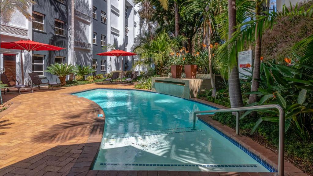 a swimming pool in the middle of a building at StayEasy Pretoria in Pretoria