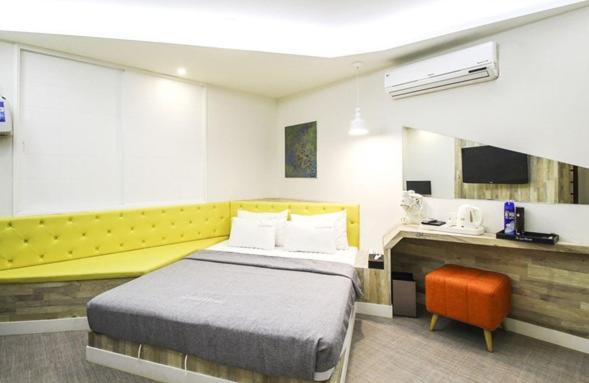 Postel nebo postele na pokoji v ubytování Hotel Home