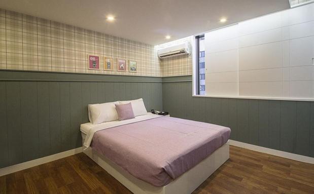 Postel nebo postele na pokoji v ubytování Hotel Home