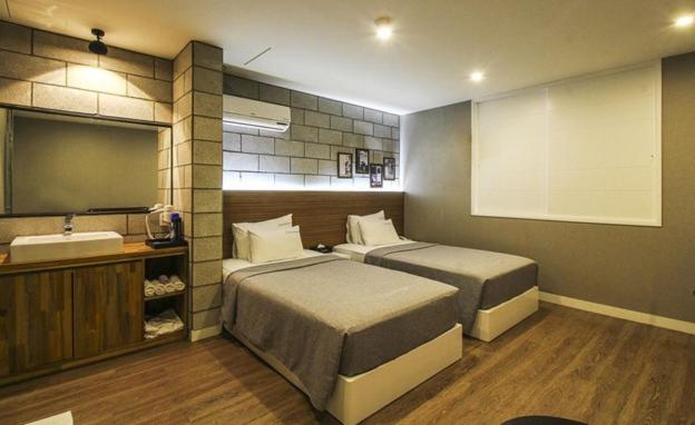 Postel nebo postele na pokoji v ubytování Hotel Home