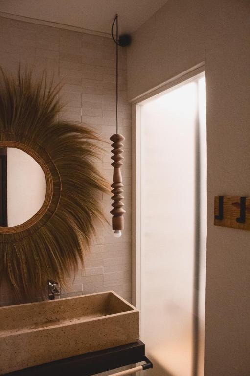 a bathroom with a mirror and a sink at Laguna Suite B&B in Chioggia