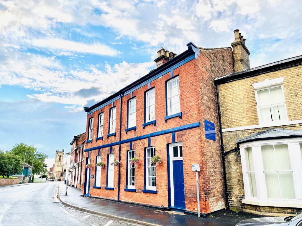 an old brick building on the side of a street at Albert House in Brigg