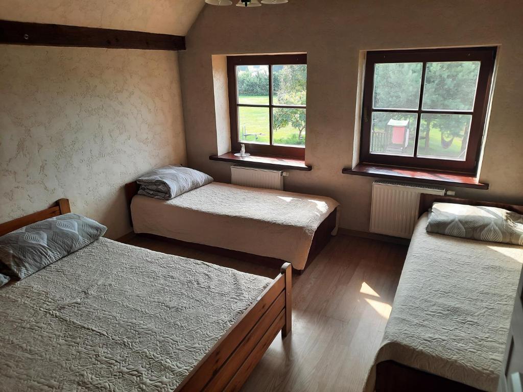 A bed or beds in a room at Vasilevičių Sodyba - Entire Homestead with Sauna