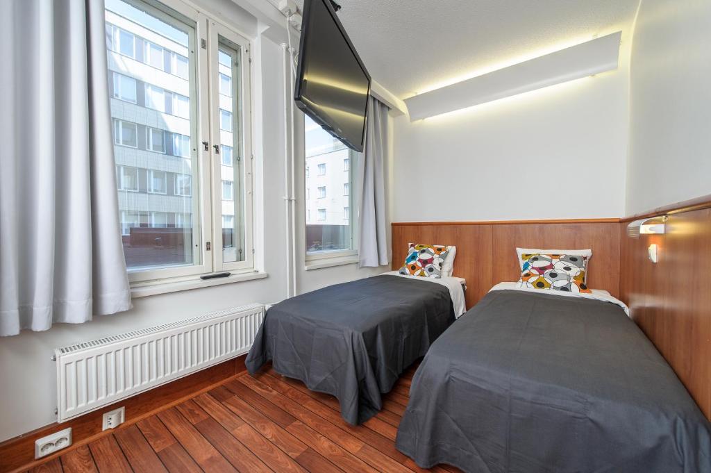 Кровать или кровати в номере Forenom Aparthotel Tampere