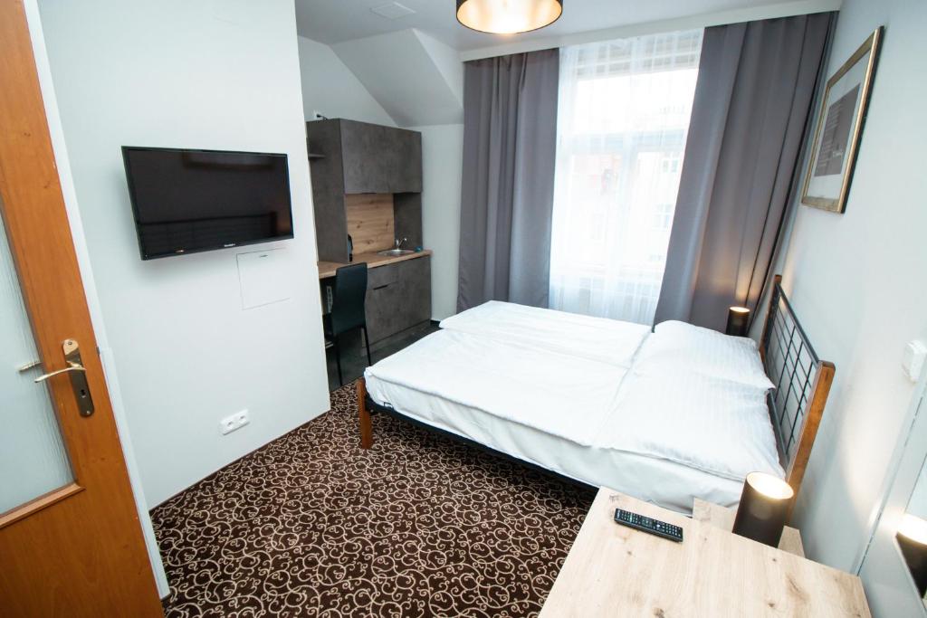 Postel nebo postele na pokoji v ubytování Hotel Brixen