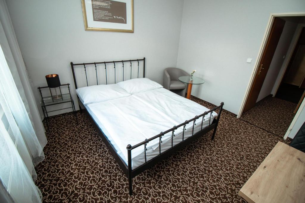 Postel nebo postele na pokoji v ubytování Hotel Brixen