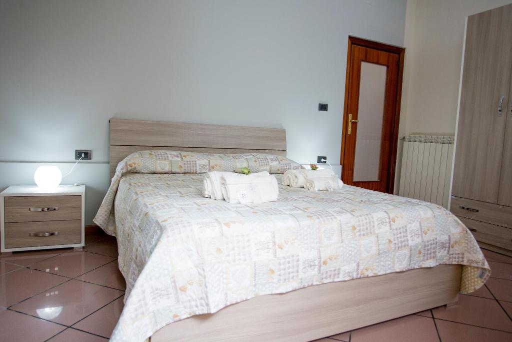 Postel nebo postele na pokoji v ubytování B&B L'Aurora CAPUA