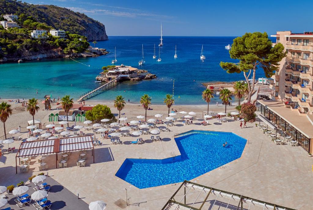 a view of a beach with a swimming pool and the ocean at Grupotel Playa Camp de Mar - Adults Only in Camp de Mar
