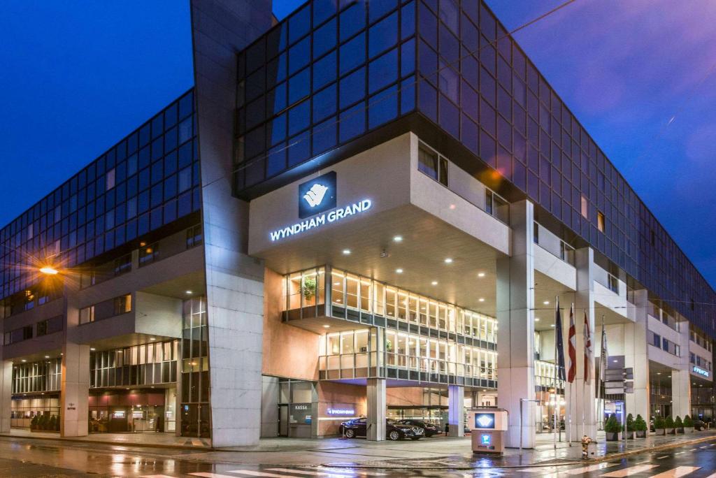 a building with a sign on the front of it at Wyndham Grand Salzburg Conference Centre in Salzburg