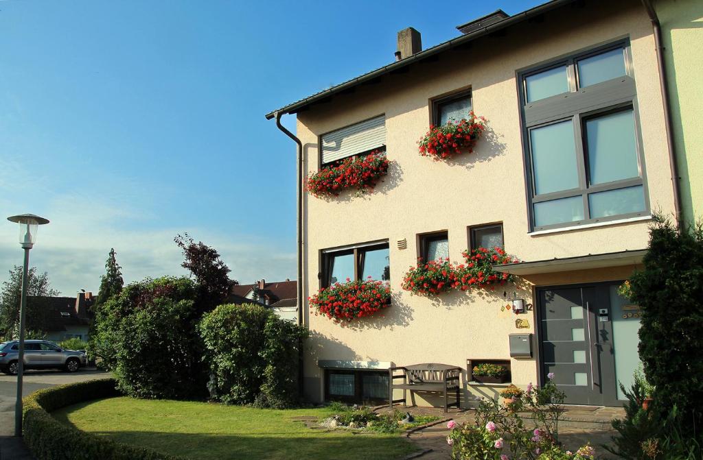 a house with flower boxes on the side of it at Ferienwohnung Haus Staffelbergblick in Bad Staffelstein