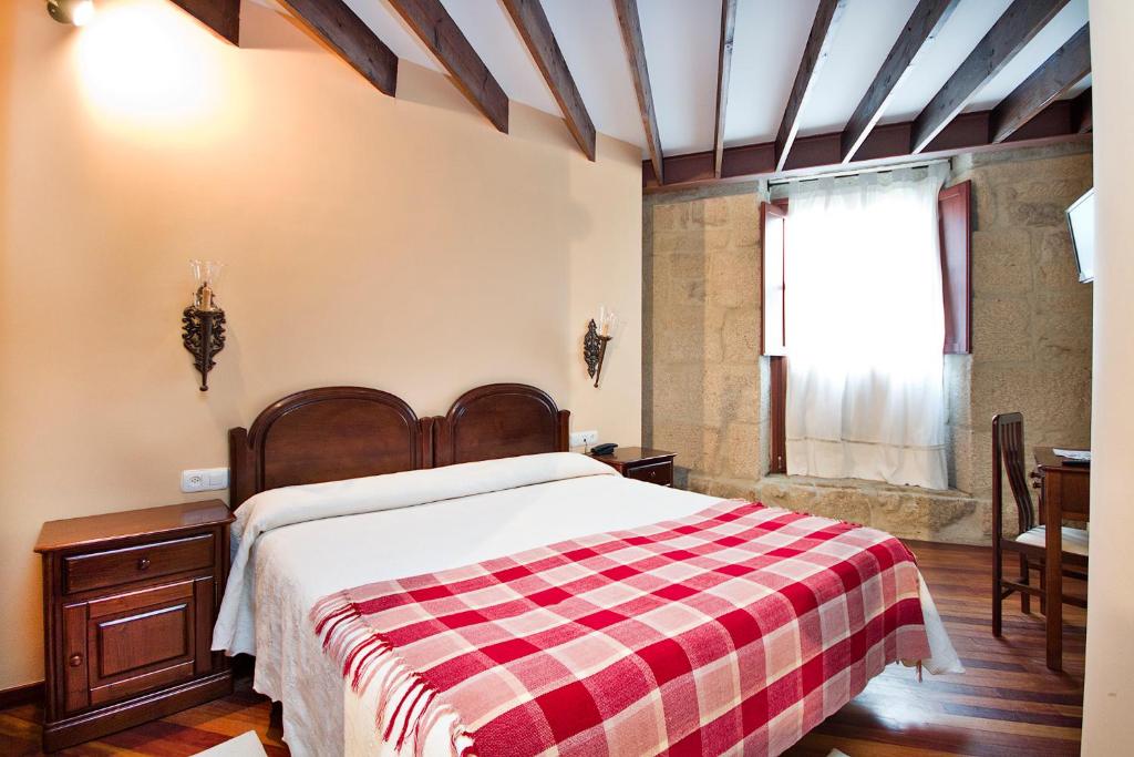Cama o camas de una habitación en Hotel O Portelo Rural