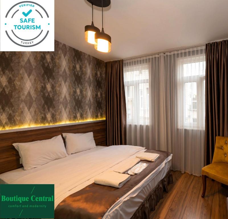 A bed or beds in a room at Boutique Central Taksim
