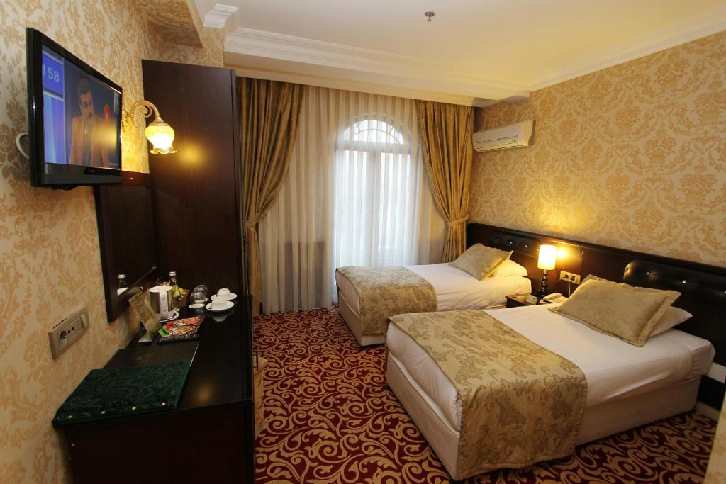 Postel nebo postele na pokoji v ubytování Balin Hotel - Special Category