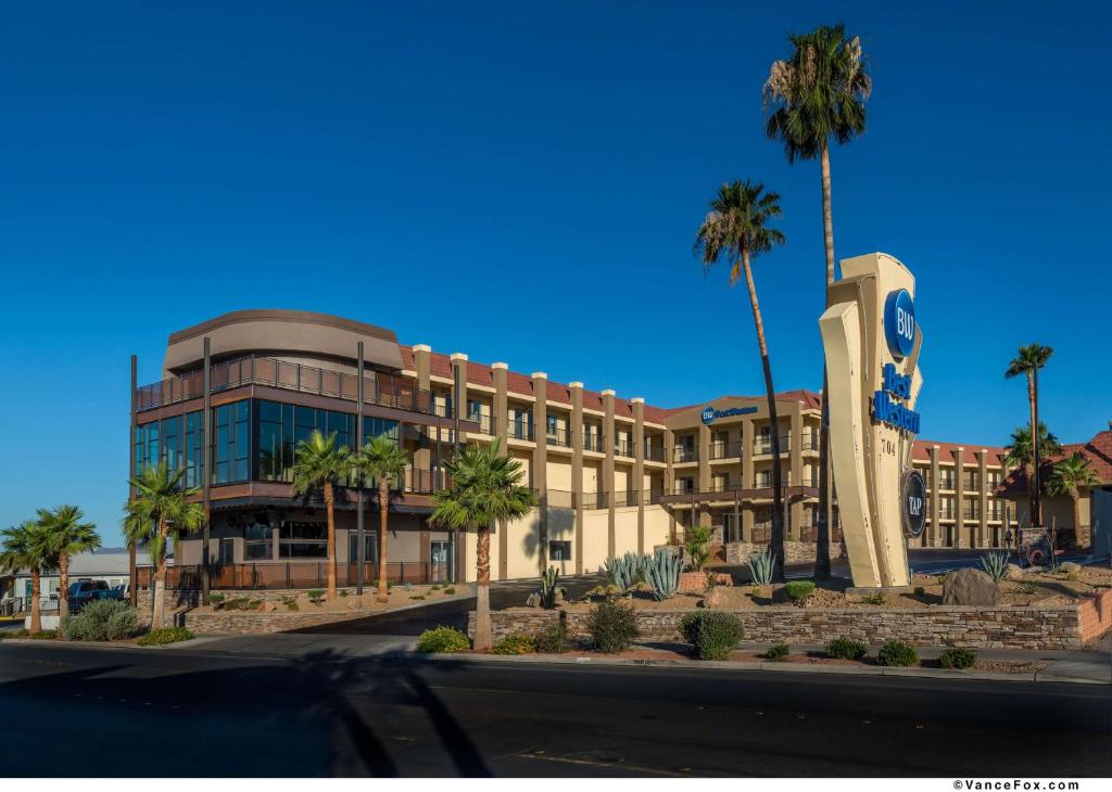 a large building with palm trees in front of it at Best Western Hoover Dam Hotel in Boulder City