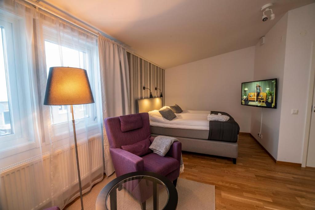 Postel nebo postele na pokoji v ubytování Simloc Hotel Drottninggatan