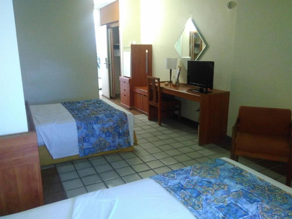Cama ou camas em um quarto em Hotel Dan Inn Mar Piedade - Grande Recife By Nacional Inn