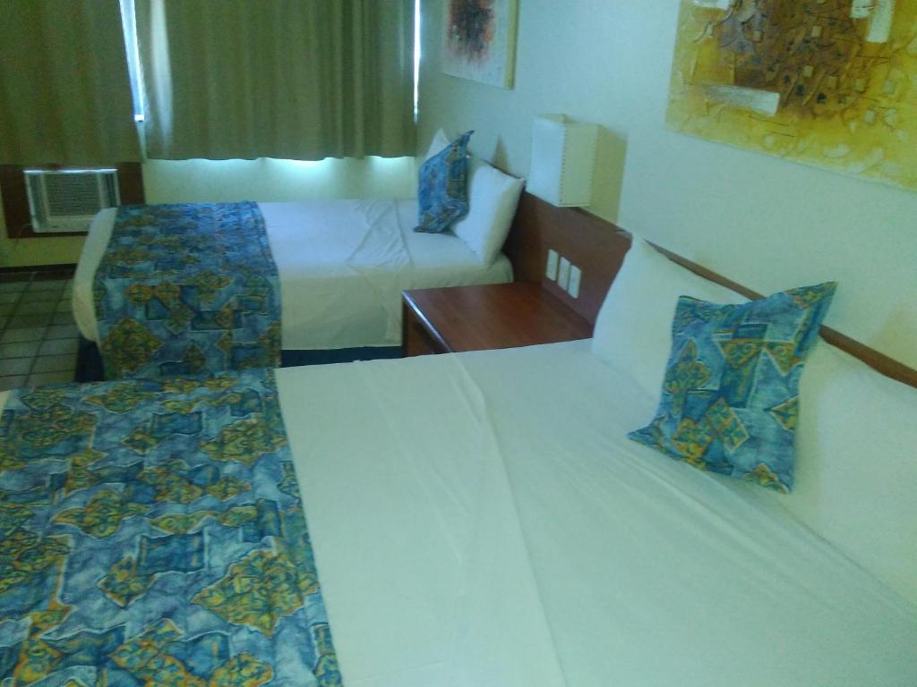 Cama ou camas em um quarto em Hotel Dan Inn Mar Piedade - Grande Recife By Nacional Inn