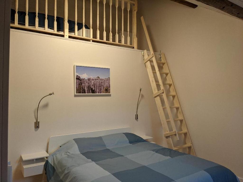 Postel nebo postele na pokoji v ubytování Les Récollets