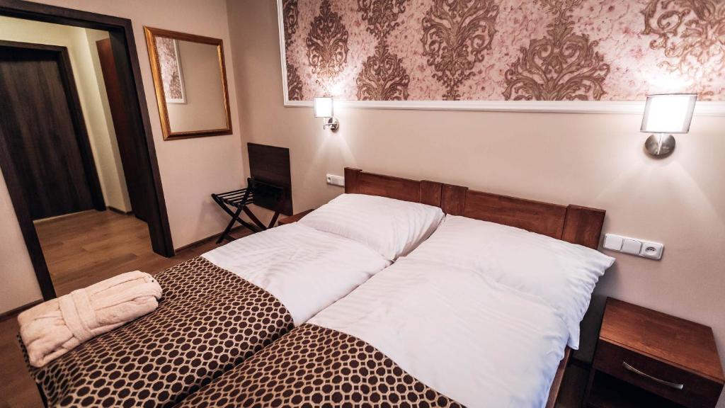 Postel nebo postele na pokoji v ubytování Star Hotel