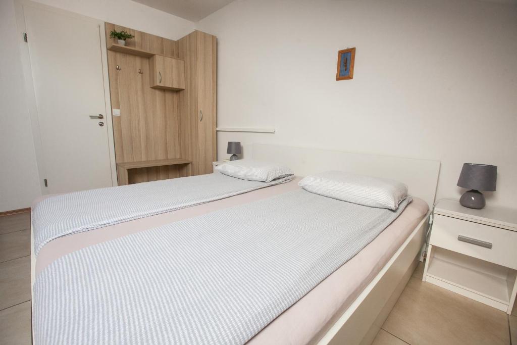 Postel nebo postele na pokoji v ubytování Rooms Klik Postojna