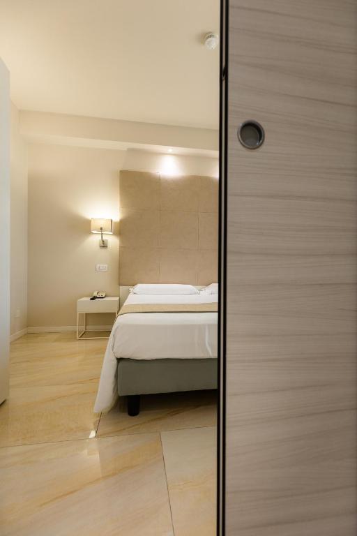 Postel nebo postele na pokoji v ubytování Hotel Du Parc