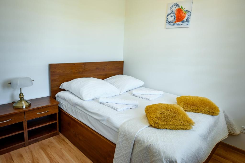 Posteľ alebo postele v izbe v ubytovaní Apartamenty Sun & Snow Kraszewskiego