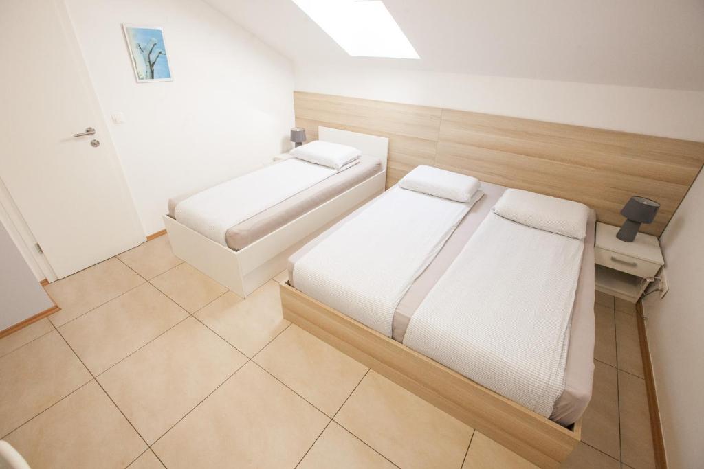 Postel nebo postele na pokoji v ubytování Rooms Klik Postojna