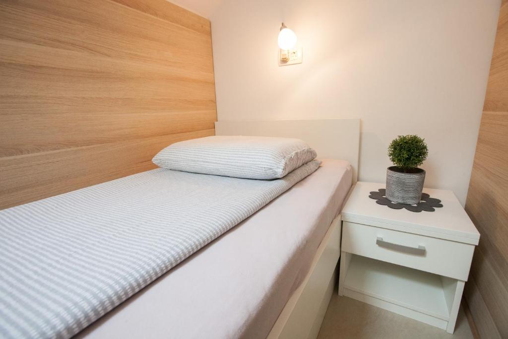 Postel nebo postele na pokoji v ubytování Rooms Klik Postojna