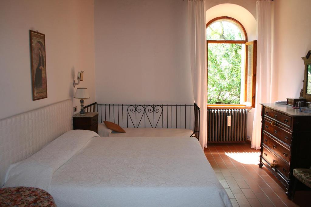 Postel nebo postele na pokoji v ubytování Antico convento Santa Chiara