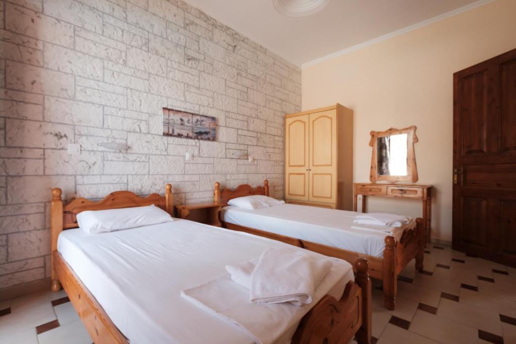 Postel nebo postele na pokoji v ubytování LUISA HOTEL
