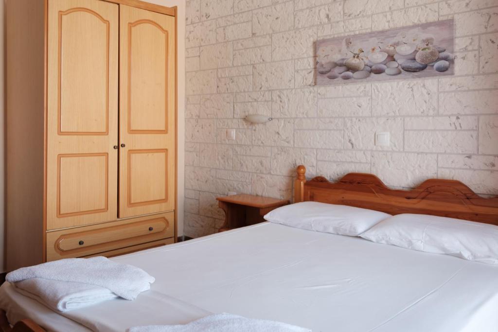 Postel nebo postele na pokoji v ubytování LUISA HOTEL